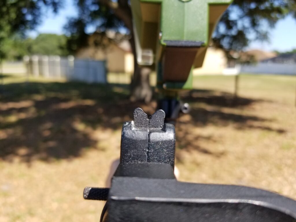 Looking down the iron sights of a Tippmann 98 Custom